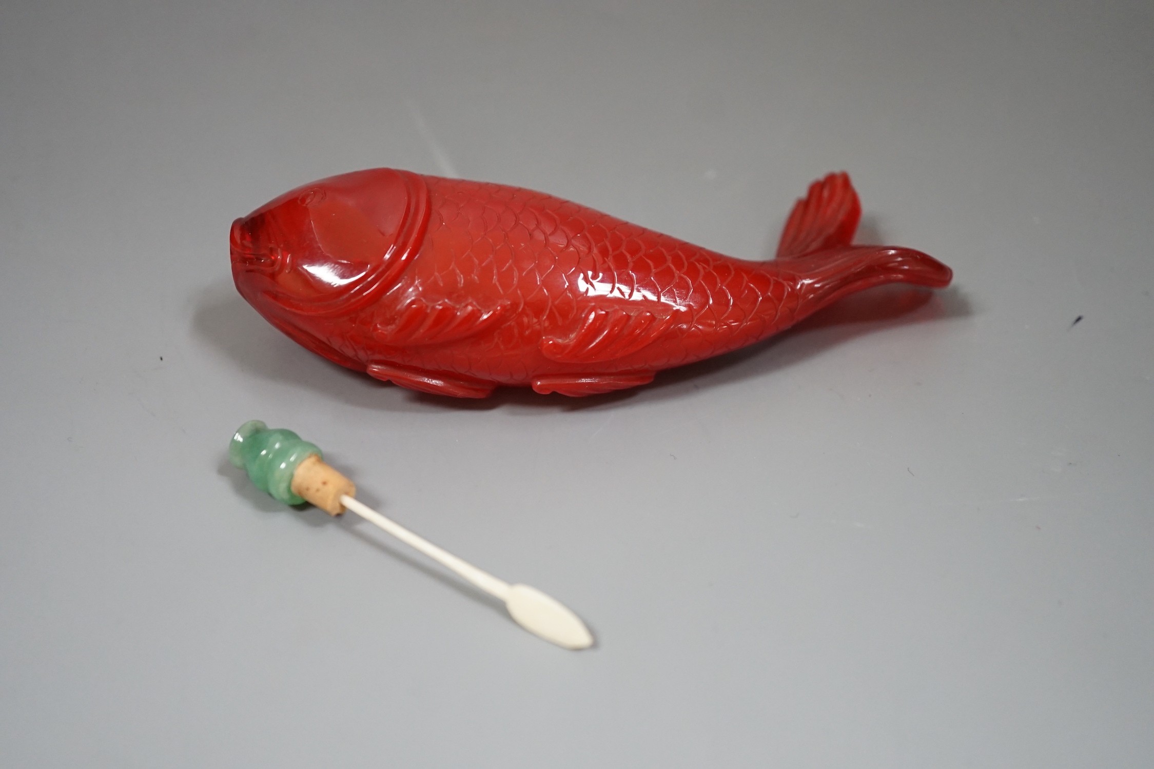 A Chinese moulded glass ‘fish’ snuff bottle, 11.5cm wide